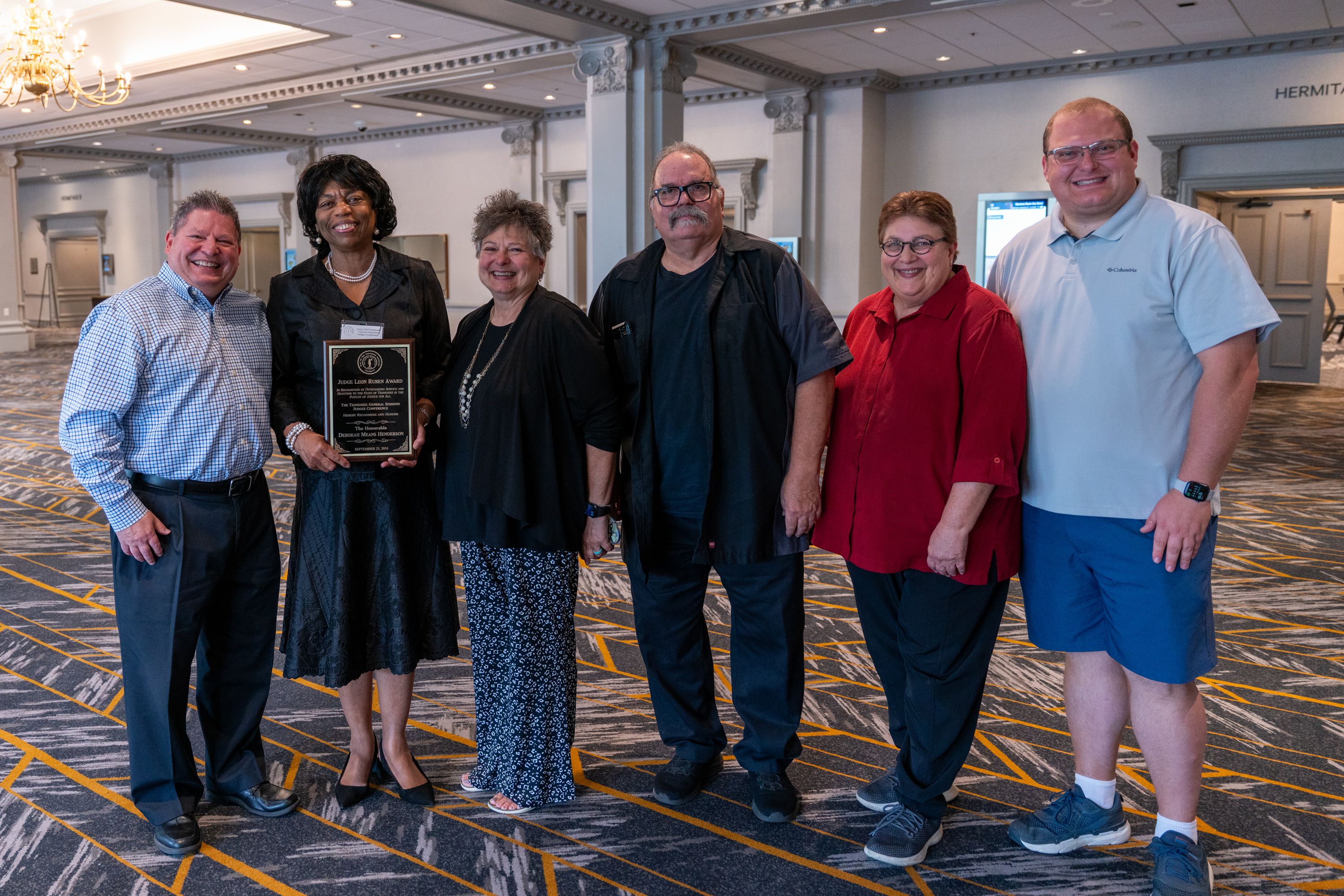 Judge Deborah Means Henderson with the family of the late Judge Leon Ruben