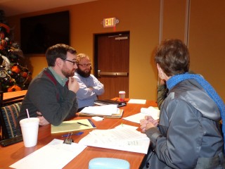 Pro Bono attorneys Alex Johnson (left) and Will McDermott meet with clients on December 19 at a legal advice clinic in Gatlinburg. Legal Aid of East Tennessee and the Sevier County Bar Association are hosting a series of clinics for Sevier County wildfire survivors.