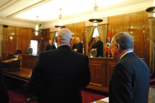 Steven H. Smartt shares some history of the Star-Spangled Banner with the Court of Criminal Appeals. In the background is Court of Criminal Appears Judge Robert W. Wedemeyer, Court of Criminal Appeals Judge John Everett Williams and Special Judge Joe H. Walker, III.